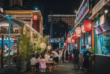 People eating outdoors at a night market in Pai